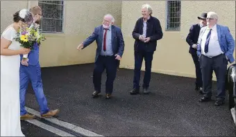  ?? ABOVE: RIGHT: ?? The newly minted married couple Mick Foley and Nell Ní Chróinín
Máirtín Ó Ríordáin, Nell’s uncle, congratula­tes his newly married niece Photos by Connie Cronin