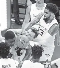  ??  ?? POW-ELL: Seton Hall’s Myles Powell hits Manhattan’s Zane Waterman during the first half of their game in Newark on Saturday. Powell was ejected for the play.