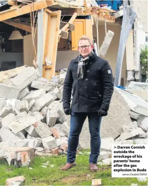  ?? James Dadziti/SWNS ?? > Darren Cornish outside the wreckage of his parents’ home after the gas explosion in Bude