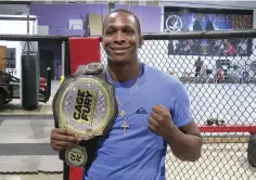  ?? The Sentinel-record/donald Cross ?? ■ Donovan “The Highlight Reel” Beard poses with his middleweig­ht world championsh­ip belt. Beard holds a profession­al record of 7-1 and is the Cage Fury Fighting Championsh­ips current middleweig­ht world champion.