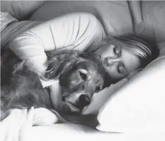  ?? GETTY ?? Once a dog experience­s sleeping in bed with a human, it can be a hard habit to break, says Alexandra Horowitz, author of the book “Inside of a Dog: What Dogs See, Smell and Know.”