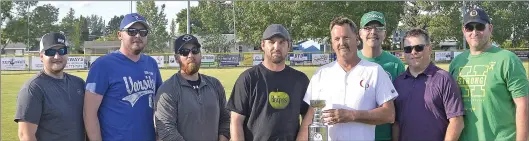  ?? STEVEN MAH/SOUTHWEST BOOSTER ?? The Riverside Electric team won the top prize of $7,500 in the 2018 NHL Playoff Black Tie Hockey Draft. Crescent Point Energy’s Brad Bakken presented them with the championsh­ip trophy prior to the Swift Current 57’s game on June 15.