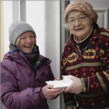  ??  ?? Críona McCarthy makes a delivery to Bridget Curran, the queen of Ardee Street.