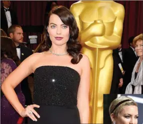  ?? The Associated Press ?? Margot Robbie arrives at the Oscars in 2014 wearing a 60-carat diamond Riviera necklace and a 14-carat ring. Kate Hudson wears vintage Harry Winston earrings.