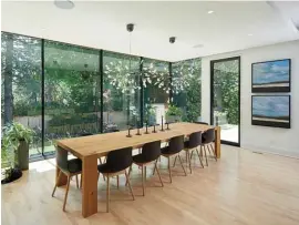  ??  ?? Right The dining room almost literally leans out into the garden. Louise calls it a “jewel box,” and she sees the long table as a daily gathering place for friends and family