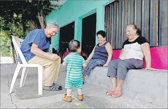  ?? Photograph­s by Gary Coronado Los Angeles Times ?? “MY FAMILY lives better than we do,” Elena said. Above, she visits her sister Edelmira Vázquez Morales and brother-in-law Jose Carlos Dueñas in her hometown.