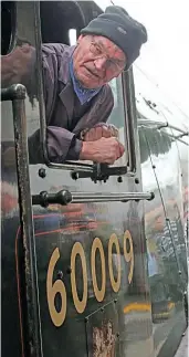  ??  ?? John Cameron is seen on his engine at York while the Pacific hauled the ‘Jubilee Requiem’ on October 25, 2014. DON BENN