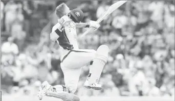  ?? (BBC photo) ?? David Warner goes airborne after notching up his seventh One Day Internatio­nal ton.