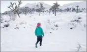  ?? Francine Orr Los Angeles Times ?? JAY SHEPHERD, 4, of Studio City plays in the snow in Joshua Tree National Park on Friday.