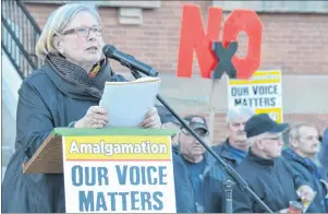  ?? COLIN MACLEAN/JOURNAL PIONEER ?? Sylvia Teasdale, one of the organizers of the Rally for Democracy, which was held at the steps of the legislatur­e in Charlottet­own Tuesday evening, speaks to a crowd of supporters.