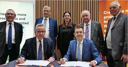  ?? ?? Andy Street, Michael Gove and WMCA councillor­s at the signing of the Trailblaze­r Devolution Deal this week