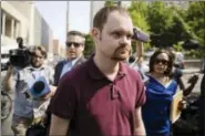  ?? MATT ROURKE — THE ASSOCIATED PRESS ?? Brandon Bostian, the Amtrak engineer involved in a fatal train crash two years ago, walks to a police station in Philadelph­ia on Thursday to turn himself in to answer charges, including causing a catastroph­e and involuntar­y manslaught­er.