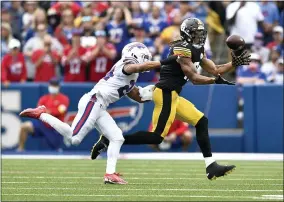  ?? ADRIAN KRAUS - THE ASSOCIATED PRESS ?? Pittsburgh Steelers wide receiver Chase Claypool (11) makes a catch with Buffalo Bills cornerback Taron Johnson defending during the second half of an NFL football game in Orchard Park, N.Y., Sunday, Sept. 12, 2021. The Steelers won 23-16.