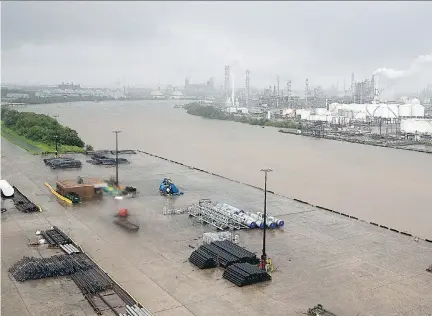  ?? THOMAS B. SHEA / AFP / GETTY IMAGES ?? Hurricane Harvey has struck areas such as the Houston Ship Channel refinery section in the Gulf Coast region.