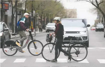  ?? PIERRE OBENDRAUF ?? The city plans to reduce vehicle traffic on city streets to make them more pedestrian and cyclist friendly during the pandemic. The plan is a breath of fresh air for urban-dwelling Montrealer­s after a long, claustroph­obic spring, Allison Hanes writes.