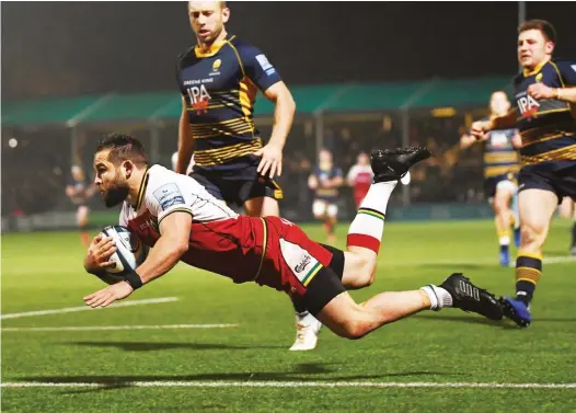  ?? PICTURES: Getty Images ?? Breakaway 1: Saints scrum half Cobus Reinach dives over to score the first try