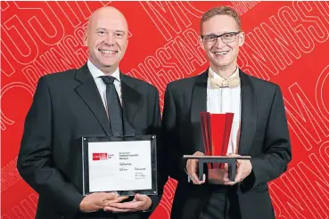  ??  ?? Bernard Fick, CEO, and David Knee, chief investment officer, at Prudential Investment Managers accept the Morningsta­r Award for the Best Fund House Larger Range at the awards ceremony in Cape Town this week.