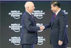  ?? Reuters ?? Founder and Executive Chairman of the WEF Klaus Schwab(left) with Chinese President Xi Jinping during the World Economic Forum meeting in Davos.