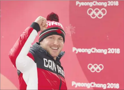  ?? The Canadian Press ?? Summerland native Justin Kripps celebrates his and teammate Alexander Kopacz’s gold medal tie with Germany in the two-man bobsled at the Pyeongchan­g 2018 Winter Olympic Games in South Korea on Monday.