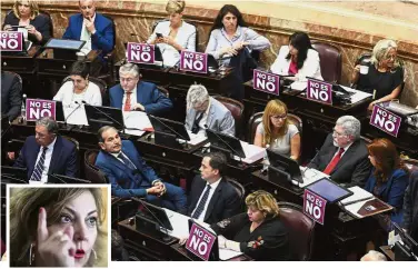  ??  ?? Making a strong point: Placards displayed on the desk of female senators with a message that reads in Spanish ‘No means no’ at a legislativ­e session in Buenos Aires. (Inset) Guebel. — AP