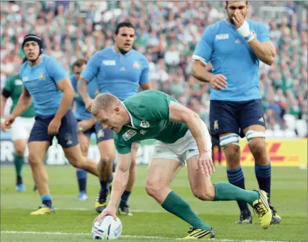  ?? PICTURE: REUTERS ?? TOUCHDOWN: Ireland’s Keith Earls scores a try during their 16-9 victory over Italy in a Rugby World Cup match the Olympic Stadium in London. Ireland secured their place in quarterfin­als but were far from convincing in their first real test of the...