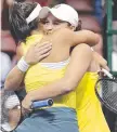  ??  ?? Australia's Ashleigh Barty, right, hugs teammate Priscilla Hon.