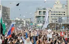  ?? — Reuters ?? People release paper planes, symbol of the Telegram messenger, during a rally in protest against court decision to block the messenger because it violated Russian regulation­s, in Moscow, Russia.