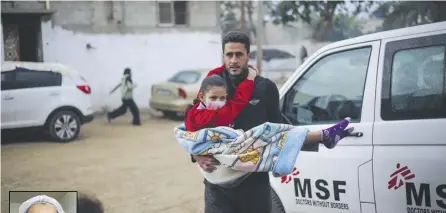  ?? Photograph © MSF ?? A man carries a wounded child into the MSF-run clinic at Rafah Indonesian Field Hospital in southern Gaza, 27 December 2023.