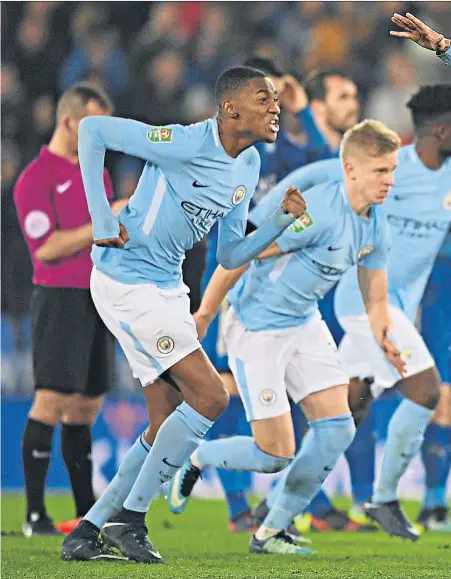  ??  ?? Young blood: Danilo leads his City team-mates in celebratio­n