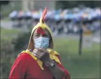  ?? CHRISTOPHE ENA - THE ASSOCIATED PRESS ?? A spectator dressed up as a rooster stands along the road of the ninth stage of the Tour de France cycling race over 153 kilometers (95 miles), with start in Pau and finish in Laruns, Sunday, Sept. 6, 2020.