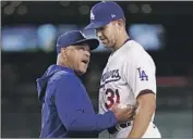  ?? Mark J. Terrill Associated Press ?? DODGERS MANAGER Dave Roberts offers some encouragem­ent to Tyler Anderson as he leaves game.