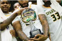  ?? BILLY SCHUERMAN/STAFF ?? Norfolk State players huddle around the CIT championsh­ip trophy after defeating Purdue Fort Wayne on Wednesday.