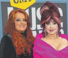  ?? JOHN AMIS/AP ?? Naomi Judd (right) with daughter Wynonna Judd last April 11.