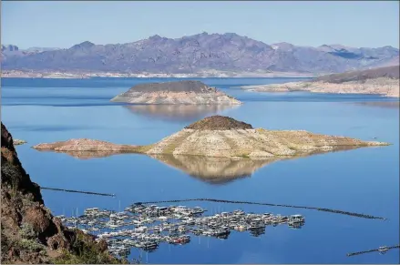  ?? LAS VEGAS NEWS BUREAU PHOTO BY SAM MORRIS ?? The Lake Mead Marina and Rock Island, as seen from the Historic Railroad Trail, which runs along the lakeshore.