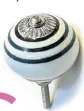  ??  ?? New doorknobs will instantly transform tired cupboards and draws. Black stripe cupboard knob £3.50, Pushka Home