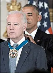 ?? OLIVIER DOULIERY/ABACA PRESS ?? President Barack Obama awards Vice President Joe Biden with the Presidenti­al Medal of Freedom, the nation’s highest civilian honor, Thursday at the White House.