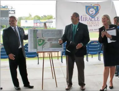  ?? KRISTI GARABRANDT — THE NEWS-HERALD ?? Lake County Captains General Manager Neil Stein, along with Eastlake Mayor Dennis Morley and Lake County Commission­er Judy Moran, talk about the future Miracle League park coming to Eastlake during a news conference held at Classic Park.