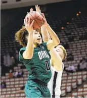  ?? STACY REVERE GETTY IMAGES ?? Ohio’s Jason Preston, who had 11 points, 13 rebounds and eight assists, shoots over UVA’S Sam Hauser.