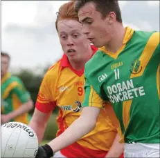  ??  ?? Cathal Kirwan of Sarsfields closes in on Rathgarogu­e-Cushinstow­n’s Paddy Barron.