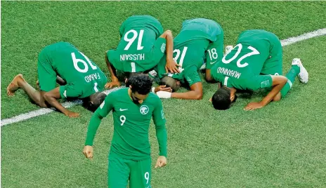  ?? Reuters ?? Saudi Arabia players celebrate their 2-1 victory against Egypt in their final Group A match in Volgograd Arena in Russia on Monday. —