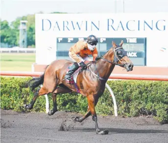  ?? Picture: KERI MEGELUS ?? Paul Shiers rides Heartz Ablaze to victory in the Hot100 Handicap at Fannie Bay