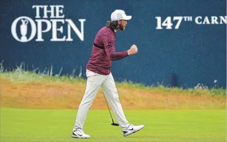  ?? STUART FRANKLIN GETTY IMAGES ?? Tommy Fleetwood celebrates a birdie on the 18th green during the second round of the 147th Open Championsh­ip on Friday.