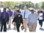  ?? (Pine Bluff Commercial/ I.C. Murrell) ?? Local and elected leaders including Pine Bluff Special Projects Coordinato­r William Fells (left), 11th District West Prosecutin­g Attorney Kyle Hunter (second right) and Jefferson County District Judge John Kearney (right) finish up the Domestic Violence Walk as they head to the Civic Center on Tuesday.