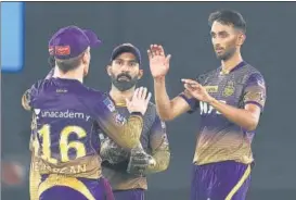  ?? BCCI ?? KKR’S Prasidh Krishna (right) bagged 3/30 to restrict Punjab Kings in Ahmedabad on Monday.