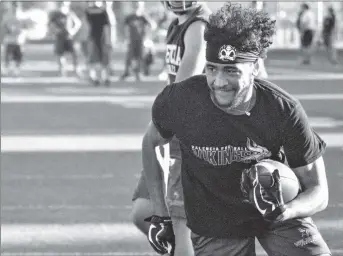  ?? Eddy Martinez/The Signal (See additional photos on signalscv.com) ?? (Above) Senior-to be Jayvaun Wilson runs the ball at Valencia High School on Friday. Wilson ran for 724 yards and 19 touchdowns on 79 carries last season. (Below) Vikings practice in the scorching heat at Valencia High School’s summer football camp in preparatio­n for the upcoming fall season.