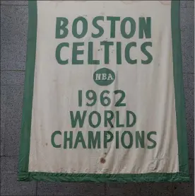  ?? NANCY LANE / BOSTON HERALD ?? Historic Celtics banners, like this one from 1962, show signs of wear from over the years.