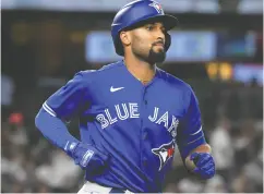  ?? BILL KOSTROUN / THE ASSOCIATED PRESS FILES ?? Of the main acquisitio­ns made by the Blue Jays last winter, Marcus Semien, left, was sensationa­l, as was pitcher Robbie Ray, right. Both are now free agents, and general manager Ross Atkins wants them to sign for another season.