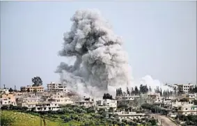  ?? MOHAMAD ABAZEED/GETTY-AFP ?? A rebel-held area in the Syrian city of Daraa was reportedly hit by an airstrike Saturday.
