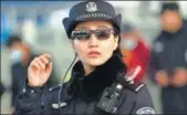  ?? COURTESY: QQ.COM ?? A Chinese police officer using the new hitech glasses equipped with facial recognitio­n technology.