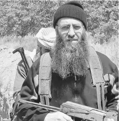  ??  ?? File photo of Assir patrolling alongside rebel fighters inside Syria, near the border with Lebanon, on the outskirts of the Syrian town of Qusayr. — AFP photo